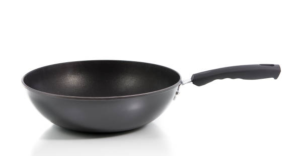 istock Closeup black frying pan isolated 697472984