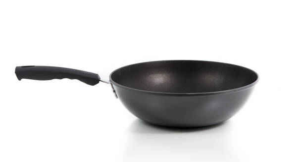istock Closeup black frying pan isolated 697472994