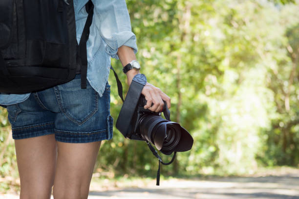 istock Asian woman taking photo 697481378