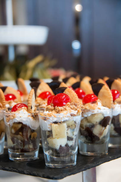 istock glasses of dessert in buffet on table 697483246
