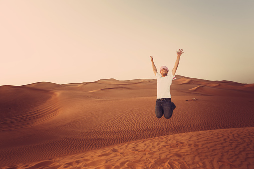 Teenage tourist in the Arabian desert.