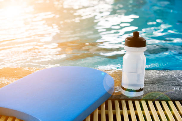istock Kick board and water bottle on swimming pool 697492322
