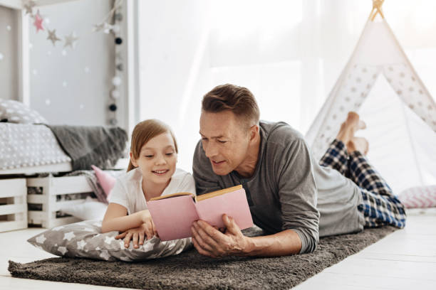 istock Clever young dad sharing his daughters hobby 697492336