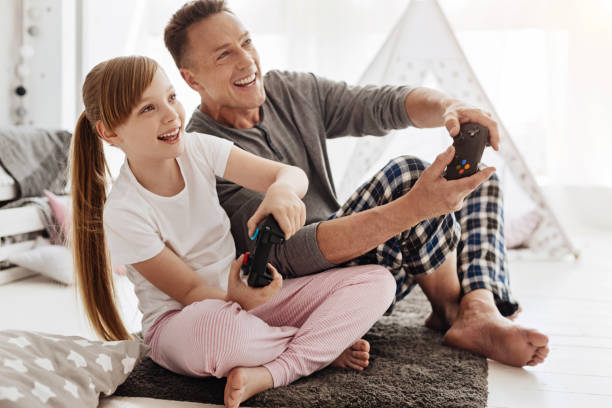 istock Passionate active family having fun with video games 697492876