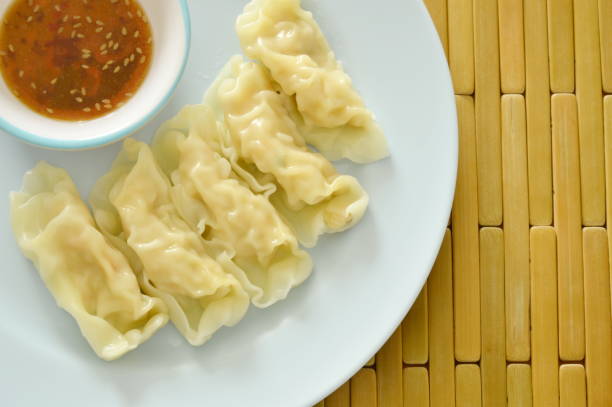istock steamed dumpling stuffed mixed mushed pork and chicken with soy sauce 697493140