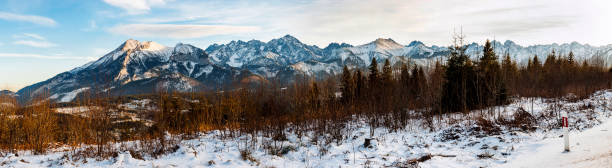 istock Panorama of mountain peaks covered with fresh snow. 697494214