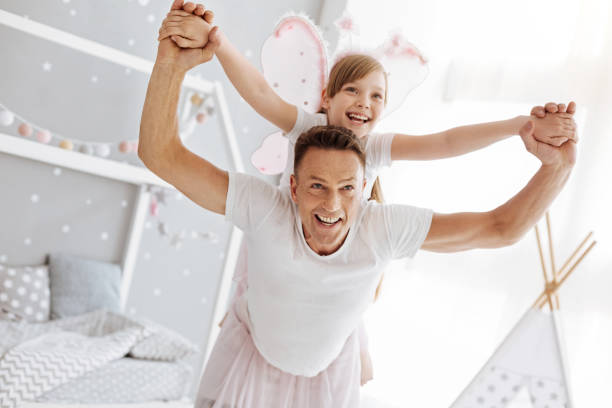 istock Energetic emotional dad making his child feeling like flying 697496352