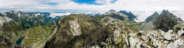 istock Summer panorama of mountains - valleys and ridges. 697500530