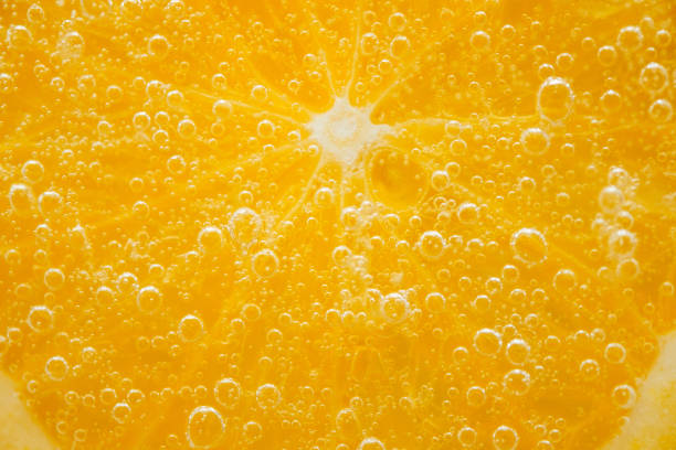 istock Sliced orange fruit close up shot 697503938