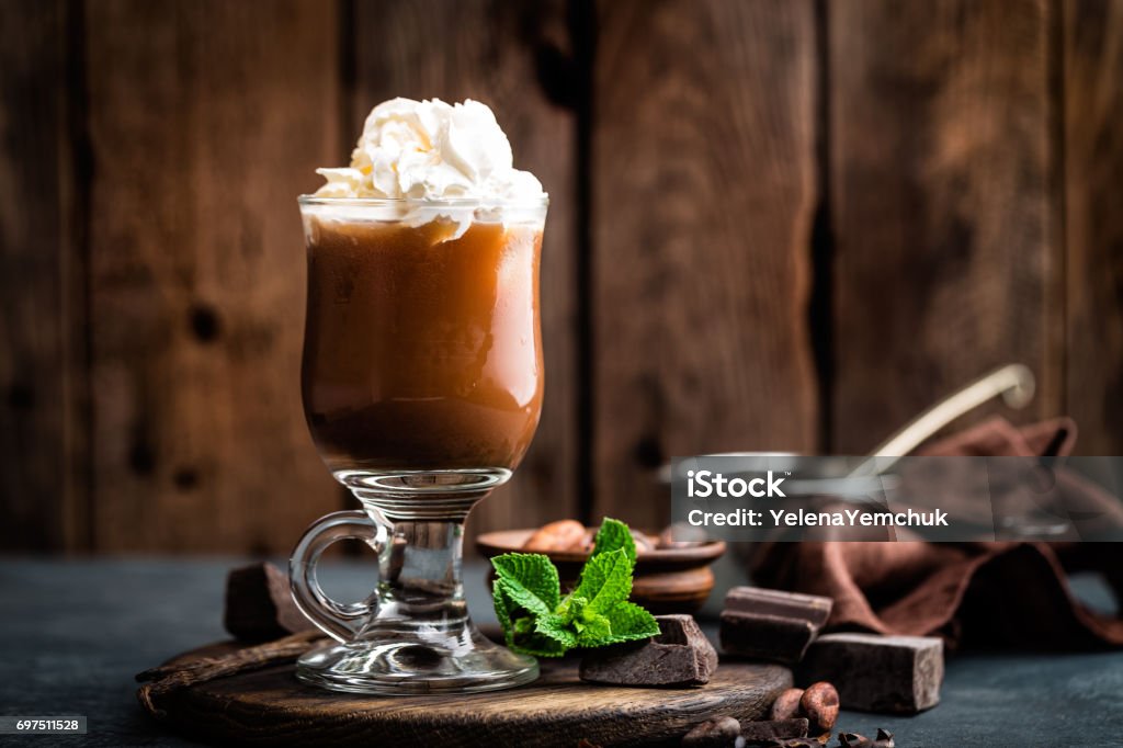 Iced cocoa drink with whipped cream, cold chocolate beverage, coffee frappe on dark background Cappuccino Stock Photo