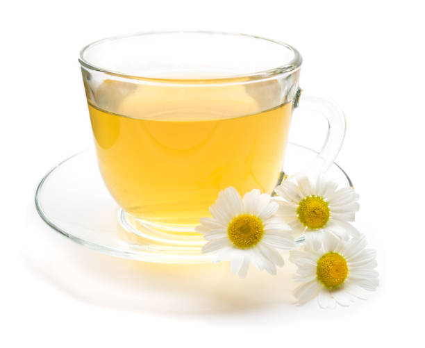 Camomile tea with chamomile flower isolated on white