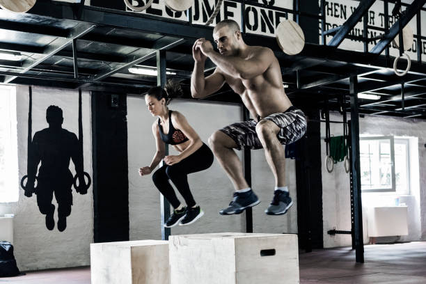 istock Man and woman working out 697518170