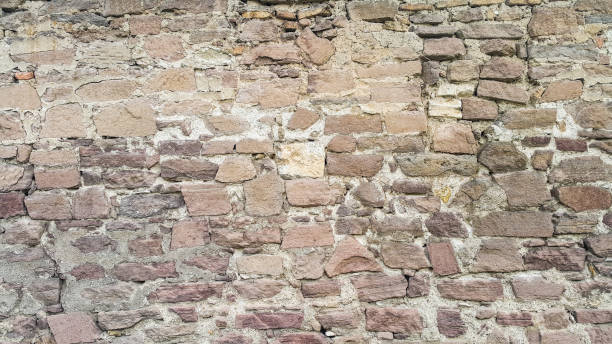istock Rock wall of ancient house 697520460