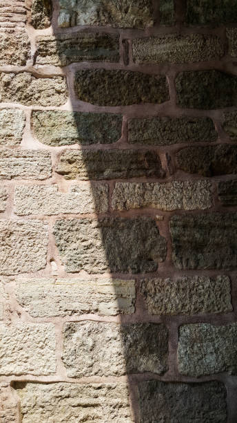 istock Light and dark on the pink stone wall 697525304