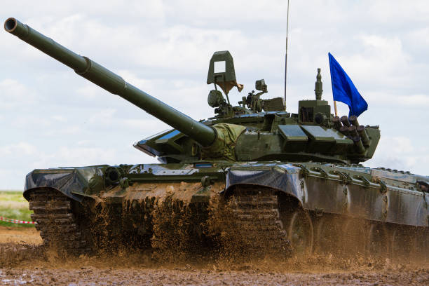 istock Army tank crosses the water obstacle 697535226