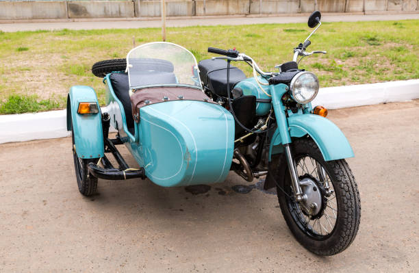 Ural motorcycle parked at the city street in summer day Samara, Russia - May 28, 2017: Ural motorcycle parked at the city street in summer day sidecar photos stock pictures, royalty-free photos & images