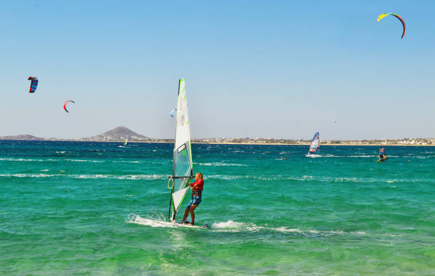 Puerto del Rosario, Fuerteventura, Spain, February 24, 2024 - Kitesurfers and windsurfers at Barlovento beach in Jandía, Fuerteventura, Canary Islands.