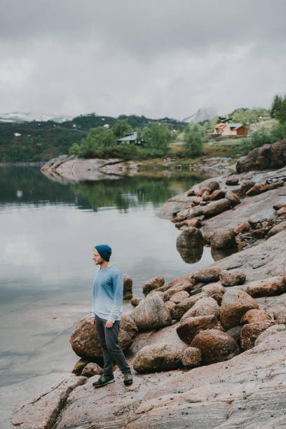 istock Man  looking at fjord in Norway 697541748