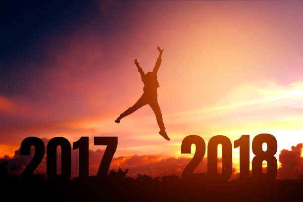 istock Silhouette young man Happy for 2018 new year 697541776