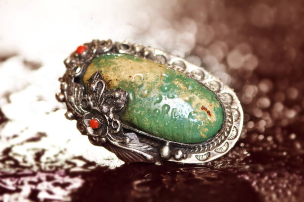 istock Beautiful and strength turquoise ring on granito scene 697541816