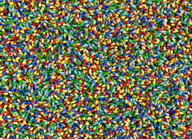 istock Colorful pills capsules background 697542096