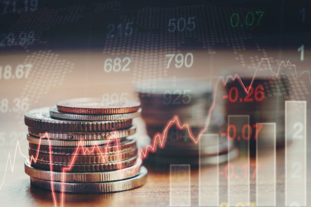 istock Graph on rows of coins for finance and banking concept 697544392