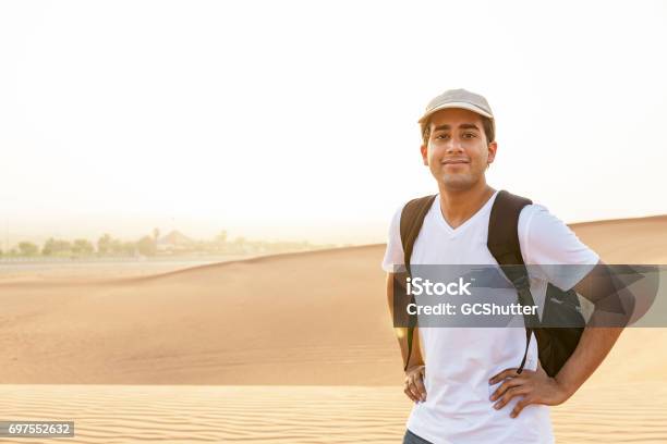 Portrait Of A Handsome Teenager At Dunes Of Arabia Stock Photo - Download Image Now - Arabia, Teenager, Tourist