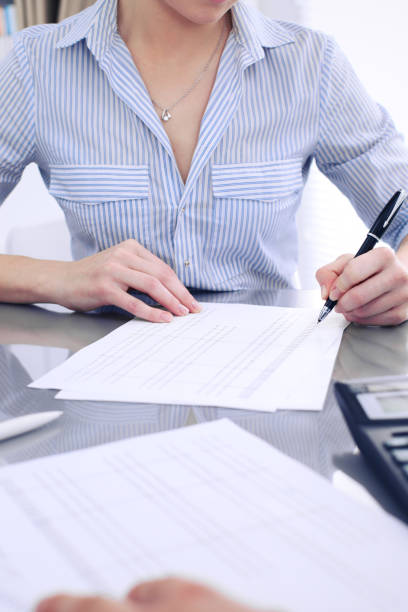 istock Bookkeepers or financial inspector making report, calculating or checking balance. Audit concept. 697555230