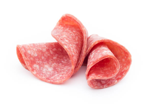 istock Salami sausage slices isolated on white background. 697558616