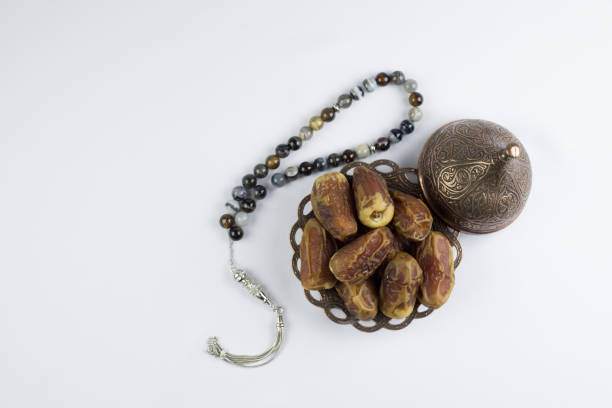 istock luxury prayer beads beads with Dates fruits 697565996