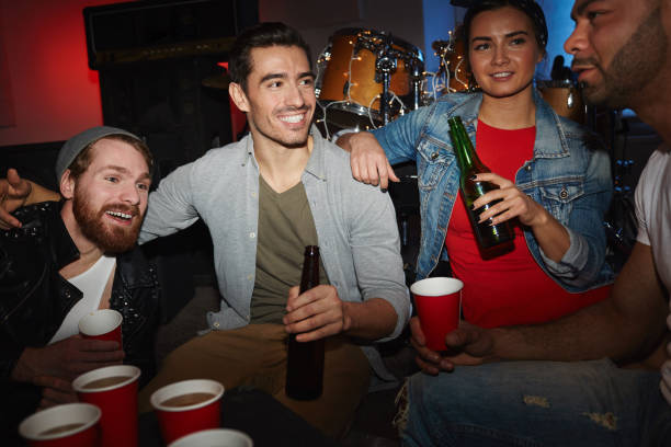 istock Friends Chilling with Beer at Party 697566342