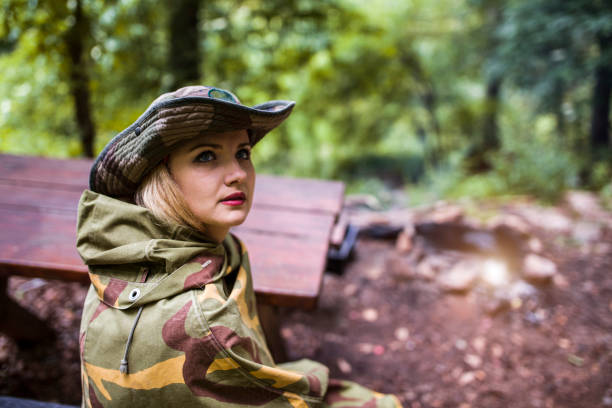 istock Camouflage woman scout in forest 697572764