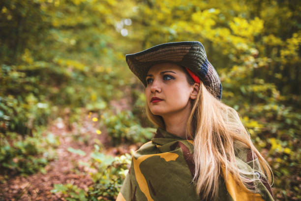 istock Camouflage woman scout in forest 697572922