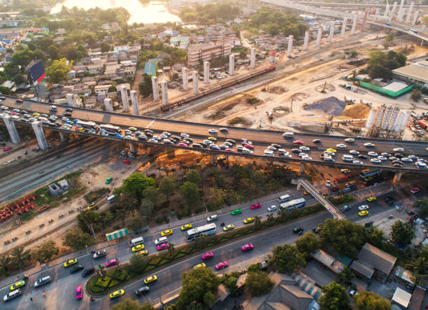 istock Traffic jam in rush hour,expressway. Freight and passenger train waiting at the train station parking lot.Cargo transit.import export and business logistic.Aerial view.Top view. Railway construction 697573294