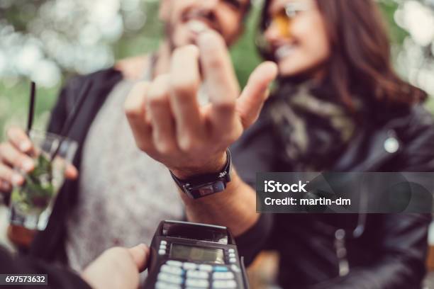 Man At Cafe Paying Contactless With Smartwatch Stock Photo - Download Image Now - Paying, Smart Watch, Contactless Payment