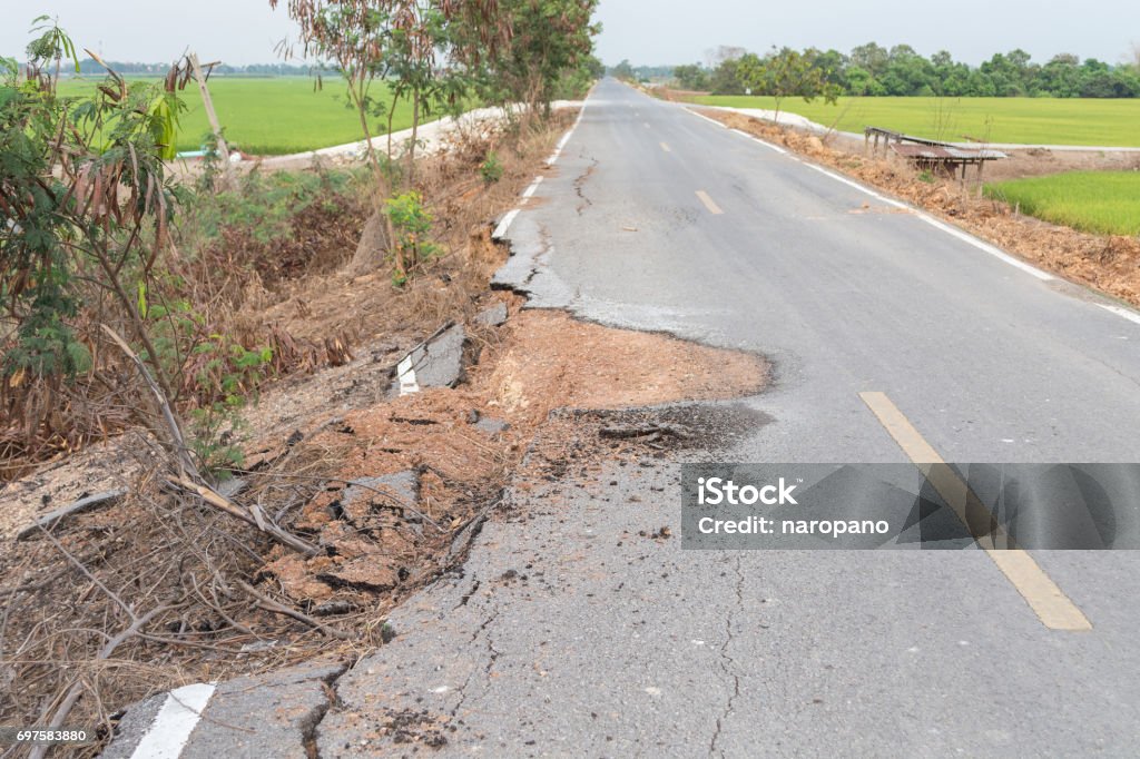 Asphalt surface on the street was demolished due to poor construction. Road Stock Photo