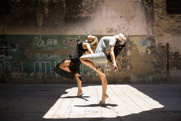 istock Female dancers performing together 697586516