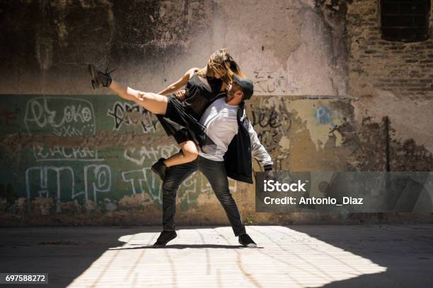 Couple Of Dancers Looking At Each Other Stock Photo - Download Image Now - Dancing, Street, Couple - Relationship