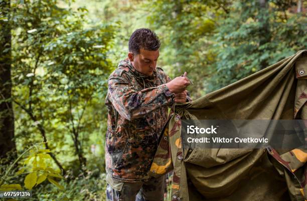 Soldier Construct The Tent Stock Photo - Download Image Now - Camping, Hunter, Hunting - Sport