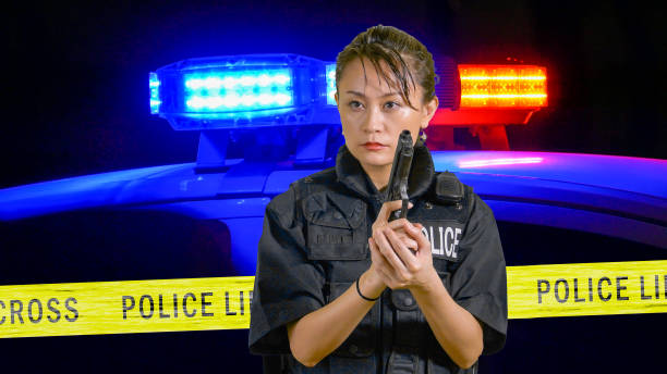 istock Asian American Policewoman pointing a pistol 697593936