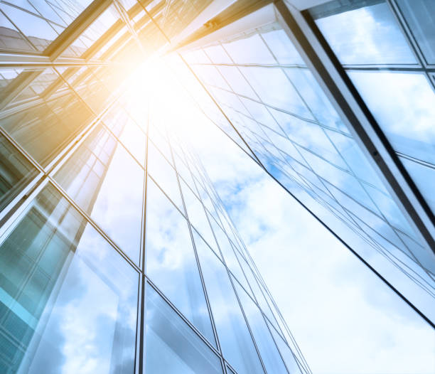 istock Bright future, finance buildings seen from below, sun 697594164