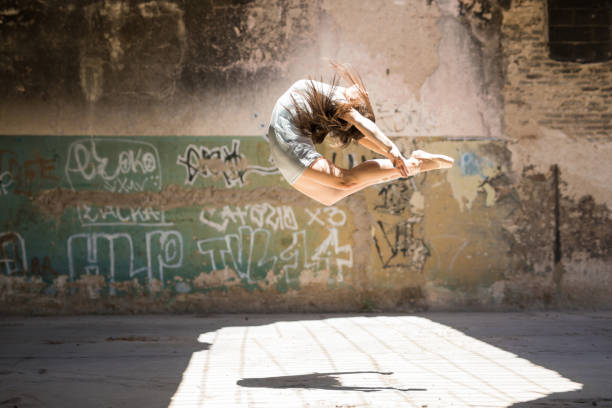istock Pretty ballerina jumping and performing 697594222
