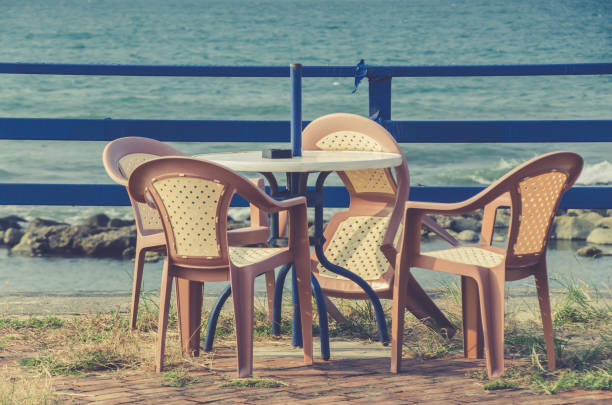 istock A set of table and chairs by seaside. 697595036