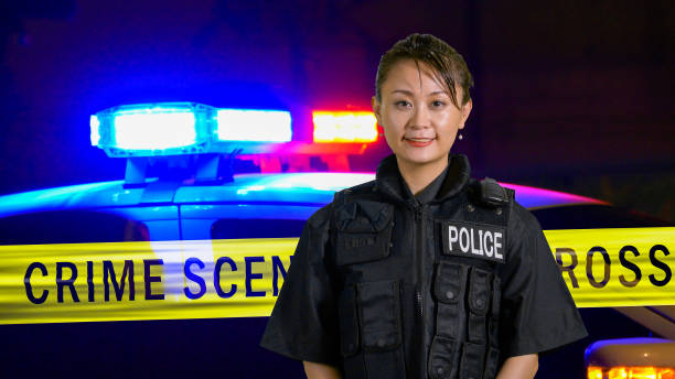 istock Asian American Policewoman smiling at camera 697597318
