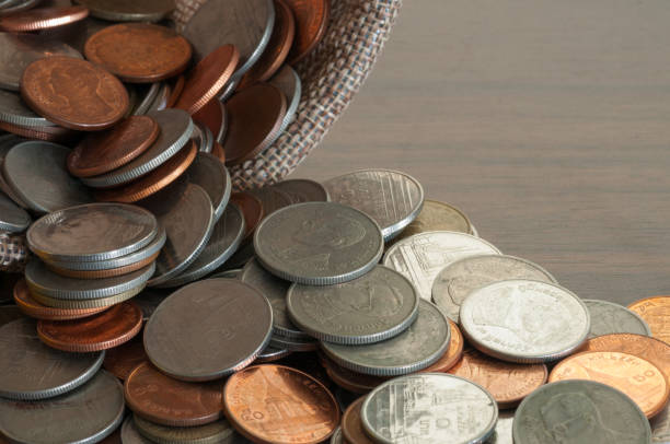 istock Open money bag on wooden table,Concept saving money 697597600