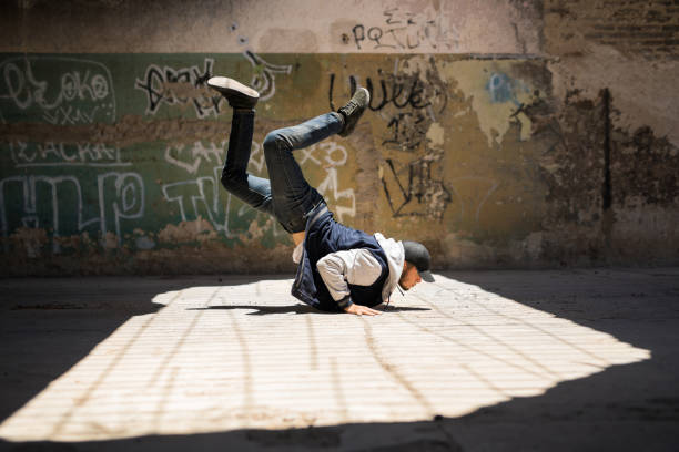 istock Young man breakdancing outdoors 697597800