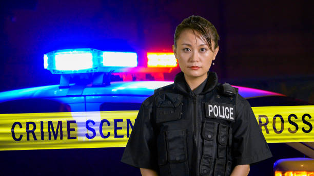istock Asian American Policewoman smiling at camera 697598258