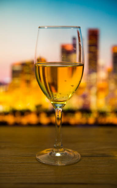 istock Champagne glasses with city background 697604634