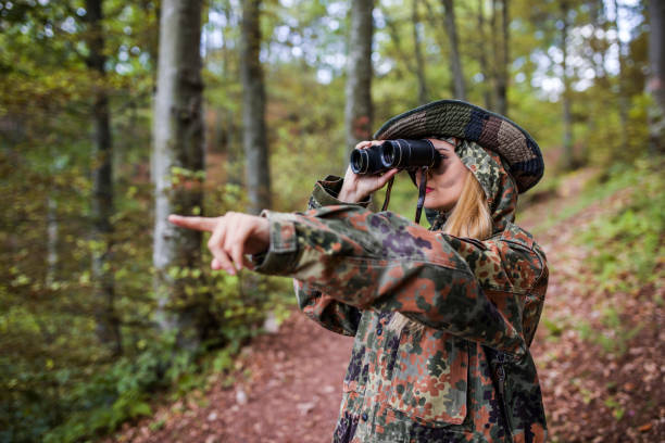 istock Woman patrol with binocular 697604660