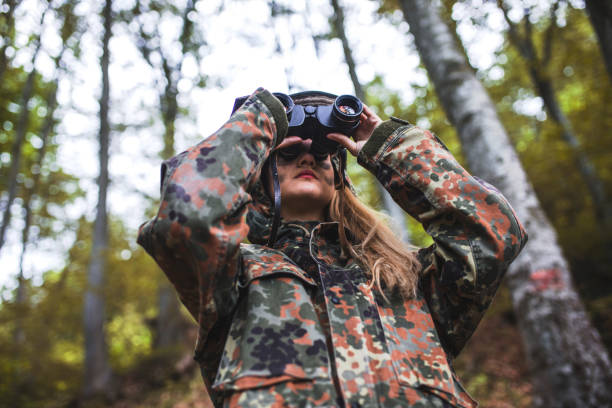 istock Woman patrol with binocular 697604662